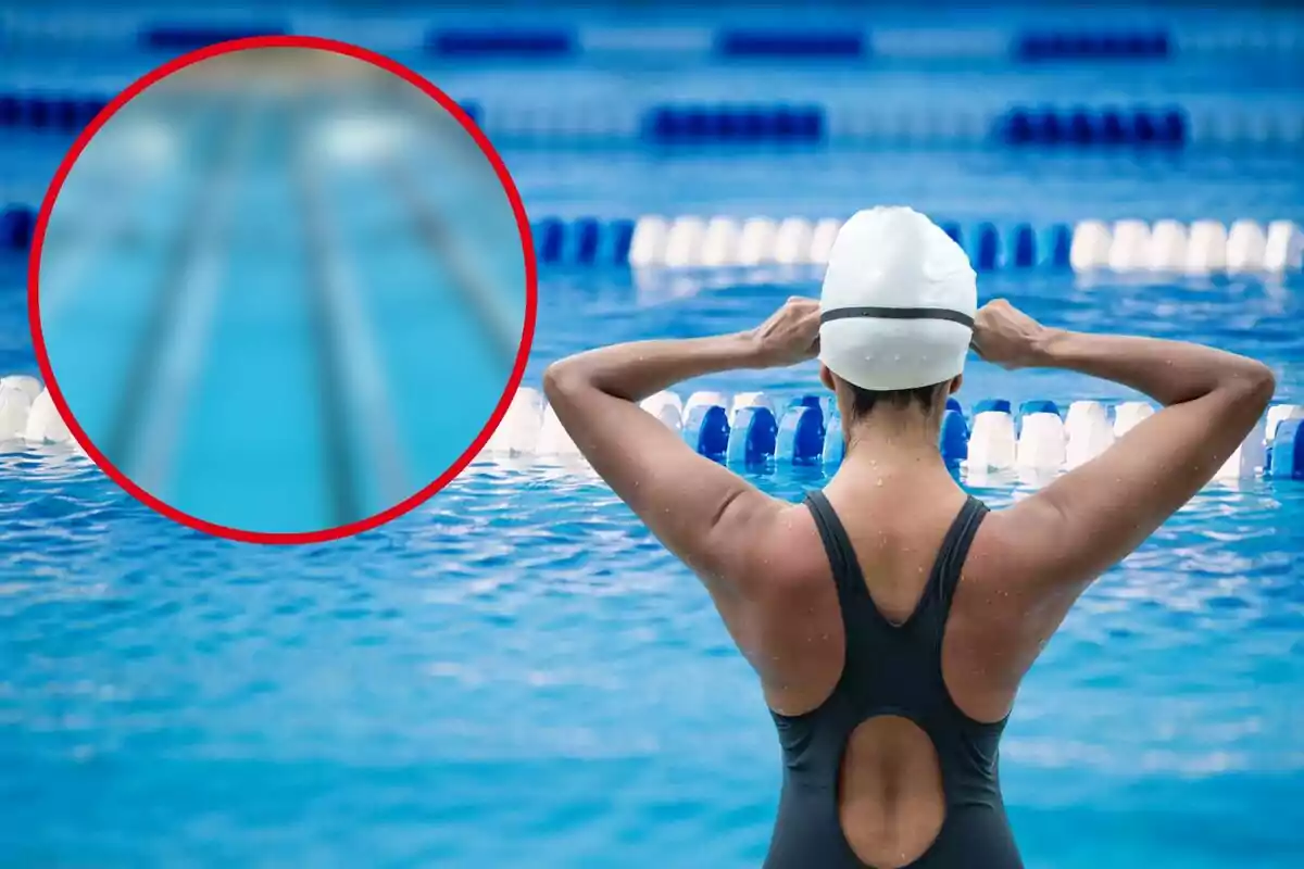 Una nadadora con gorro de natación se prepara en una piscina con carriles azules y blancos.