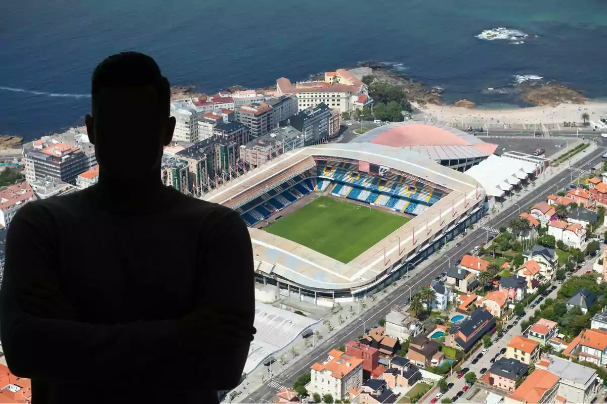 Una persona en silueta se encuentra frente a un estadio de fútbol y una ciudad costera.