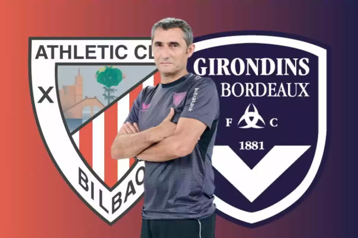 Un hombre con los brazos cruzados frente a los escudos del Athletic Club de Bilbao y el Girondins de Bordeaux.