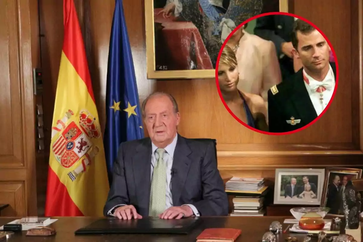 Un hombre mayor sentado en un escritorio con las banderas de España y la Unión Europea detrás de él, con una imagen circular insertada en la esquina superior derecha que muestra a una mujer y un hombre en uniforme militar.