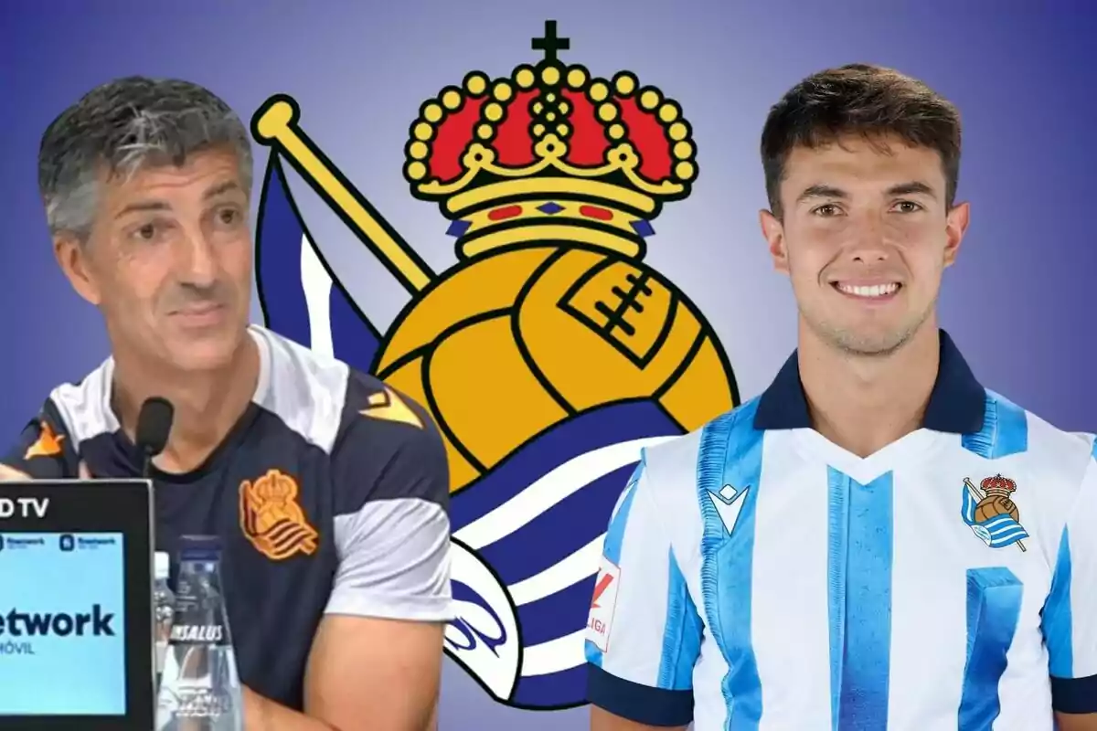 Dos personas con uniformes de la Real Sociedad frente al escudo del equipo.